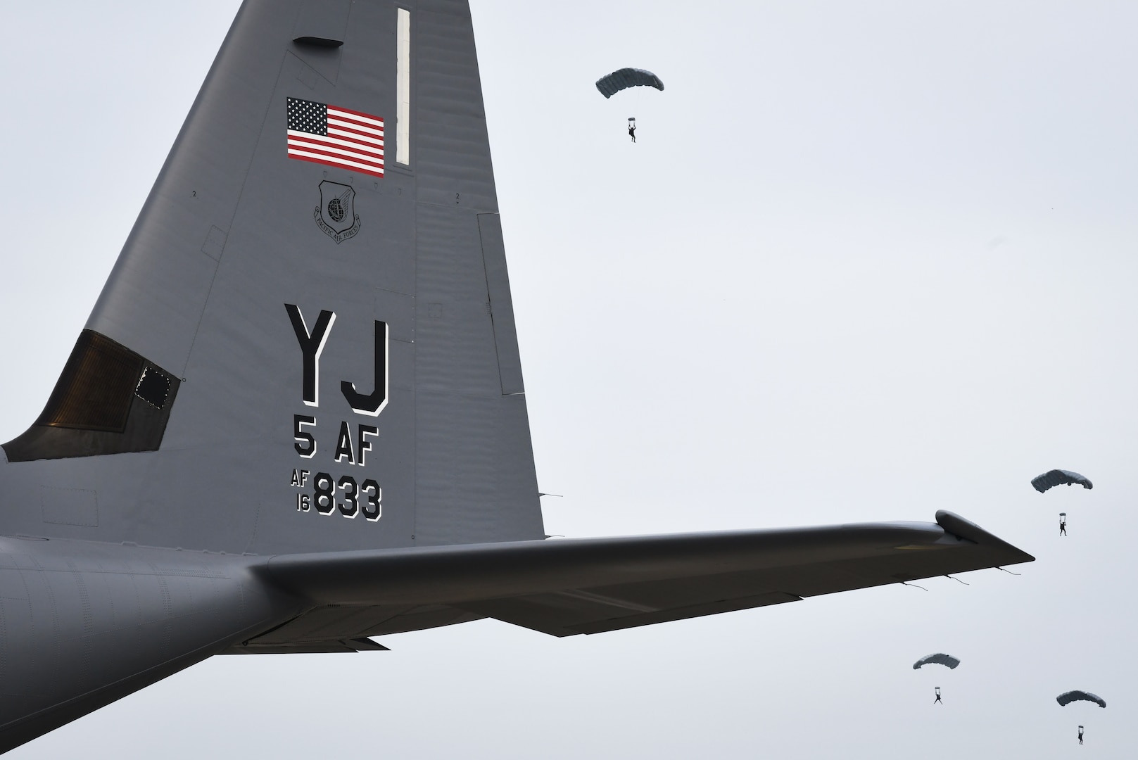 A U.S. Air Force C-130J Super Hercules assigned to the 36th Airlift Squadron parks on the flightline in front of Japan Ground Self-Defense Force paratroopers at Yokota Air Base, Japan, during Exercise Beverly Morning 24-1, Oct. 25, 2023. The C-130J aircrew had just returned from an airdrop mission to complete a simulated delivery of medical aid and military equipment. (U.S. Air Force Photo by Staff Sgt. Spencer Tobler)