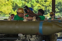 Airmen from the 2nd Munitions Squadron attach bomb lug extenders and hardback assembly onto a BLU-109 bomb body during the Global Strike Challenge Sep. 7, 2023 at Barksdale Air Force Base, La. Approximately 450 Airmen from four major commands train for and compete in challenges against the best of the other units with similar aircrew and maintenance missions. (U.S. Air Force photo by Airman 1st Class Seth Watson)