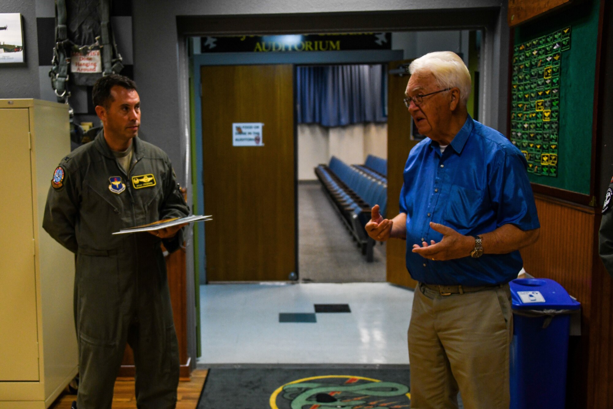 Air Force wing commander talks to Norwegian man.