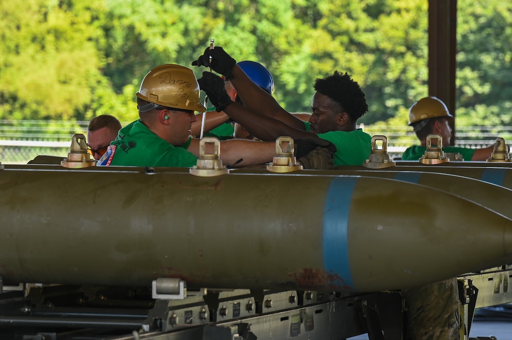 Airmen from the 2nd Munitions Squadron attach bomb lug extenders and hardback assembly onto a BLU-109 bomb body during the Global Strike Challenge Sep. 7, 2023 at Barksdale Air Force Base, La. Approximately 450 Airmen from four major commands train for and compete in challenges against the best of the other units with similar aircrew and maintenance missions. (U.S. Air Force photo by Airman 1st Class Seth Watson)