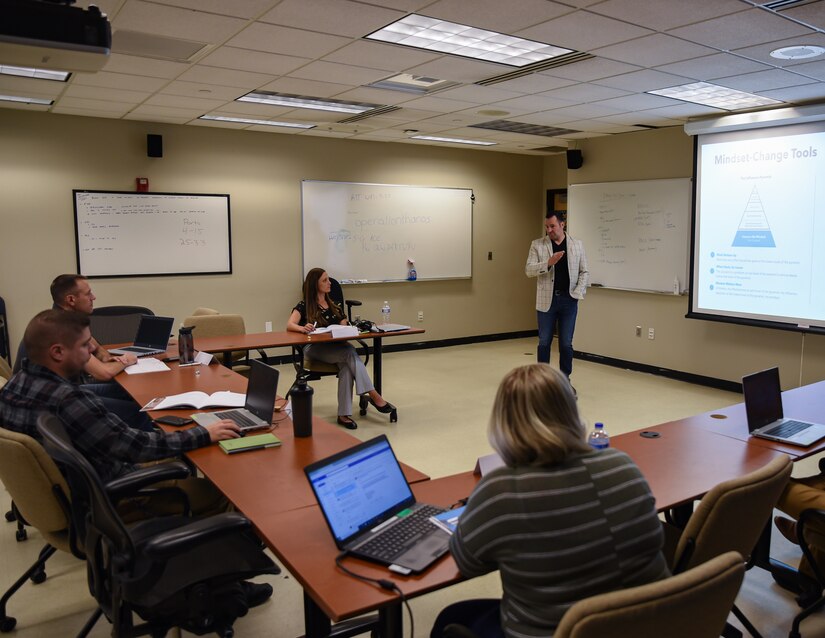 Utah Air National Guard members sit in a classroom and participate in leadership training.