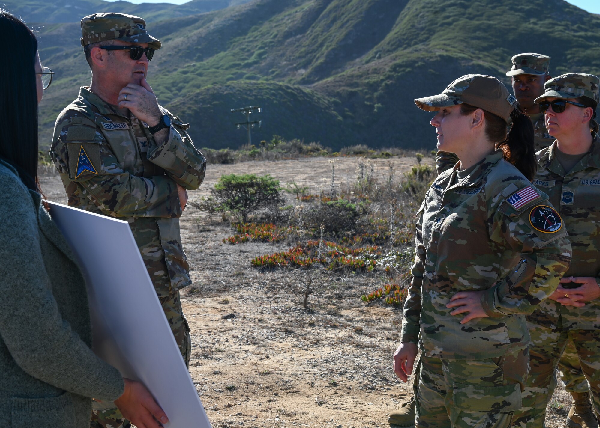 Vandenberg base commander talks with Brig. Gen. Panzenhagen while she tours Vandenberg.