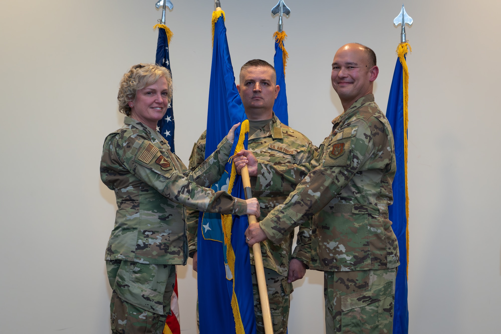 General passing flag to Colonel during ceremony.