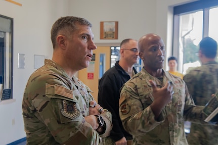U.S. Air Force Maj. Gen. John Klein, U.S. Air Force Expeditionary Center commander, left, learns about facility upgrades from Lt. Col. Travares Dozier, 628th Force Support Squadron commander, right, during his visit to the Naval Weapons Station, Goose Creek, South Carolina, Nov. 2, 2023.