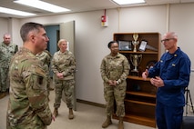 U.S. Air Force Maj. Gen. John Klein, U.S. Air Force Expeditionary Center commander, listens to mental health providers at the 628th Medical Group, during a visit to Joint Base Charleston, South Carolina, Nov. 2, 2023.