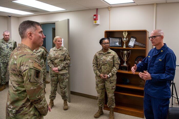 U.S. Air Force Maj. Gen. John Klein, U.S. Air Force Expeditionary Center commander, listens to mental health providers at the 628th Medical Group, during a visit to Joint Base Charleston, South Carolina, Nov. 2, 2023.