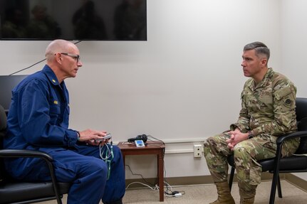 U.S. Public Health Service Lt. Cmdr. Brian Reiner, 628th Operational Medical Readiness Squadron mental health element lead, left, and Maj. Gen. John Klein, U.S. Air Force Expeditionary Center commander, engage in a discussion on mental health on Joint Base Charleston, South Carolina, Nov. 2, 2023.