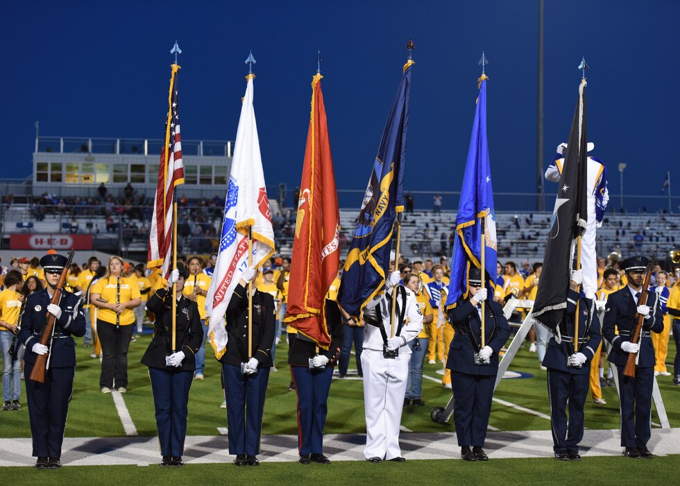 Goodfellow Air Force Base’s joint color guard presented the armed forces’ flags during halftime as all branches of the military were recognized during Military Appreciation Day, San Angelo, Texas, Nov. 4, 2023. Each branch was invited to stand and be recognized when their branch song played. (U.S. Air Force photo by Staff Sgt. Nathan Call)