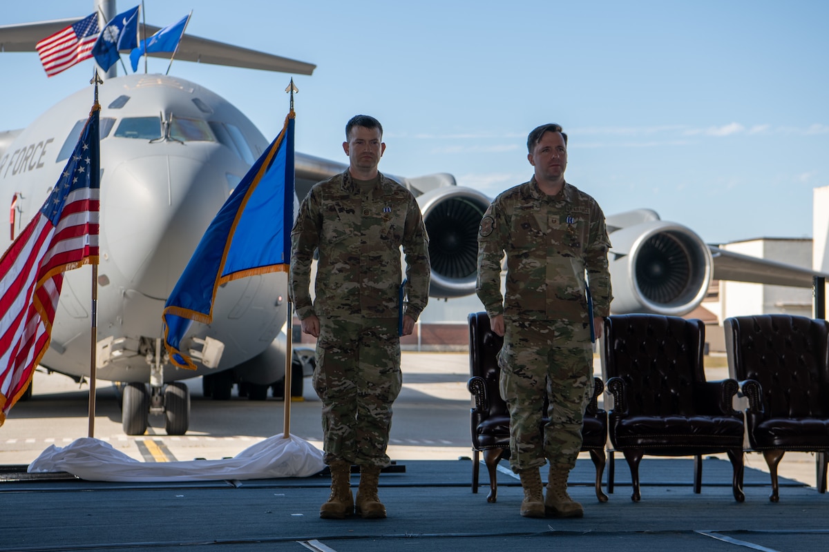 Two members of the Air Force Reserve's 315th Airlift Wing were presented the Distinguished Flying Cross during a ceremony held here November 5, 2023. Master Sgt. Josh Lewis and Master Sgt. Adam Stewart, Flying Crew Chiefs with the 315th Aircraft Maintenance Squadron, received the Distinguished Flying Cross for their efforts as part of Operation Allies Refuge in 2021, during which they helped firsthand to evacuate hundreds of civilians via air from Kabul, Afghanistan, to include a baby born while in flight. (U.S. Air Force photo by Master Sgt. Jeffrey Fitzmorris)