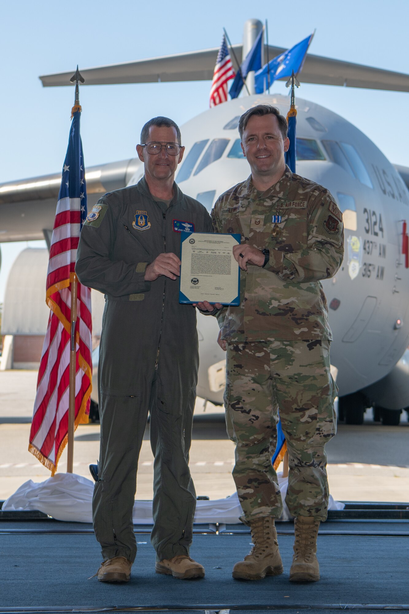 Two members of the Air Force Reserve's 315th Airlift Wing were presented the Distinguished Flying Cross during a ceremony held here November 5, 2023. Master Sgt. Josh Lewis and Master Sgt. Adam Stewart, Flying Crew Chiefs with the 315th Aircraft Maintenance Squadron, received the Distinguished Flying Cross for their efforts as part of Operation Allies Refuge in 2021, during which they helped firsthand to evacuate hundreds of civilians via air from Kabul, Afghanistan, to include a baby born while in flight. 
(U.S. Air Force photo by Master Sgt. Jeffrey Fitzmorris)