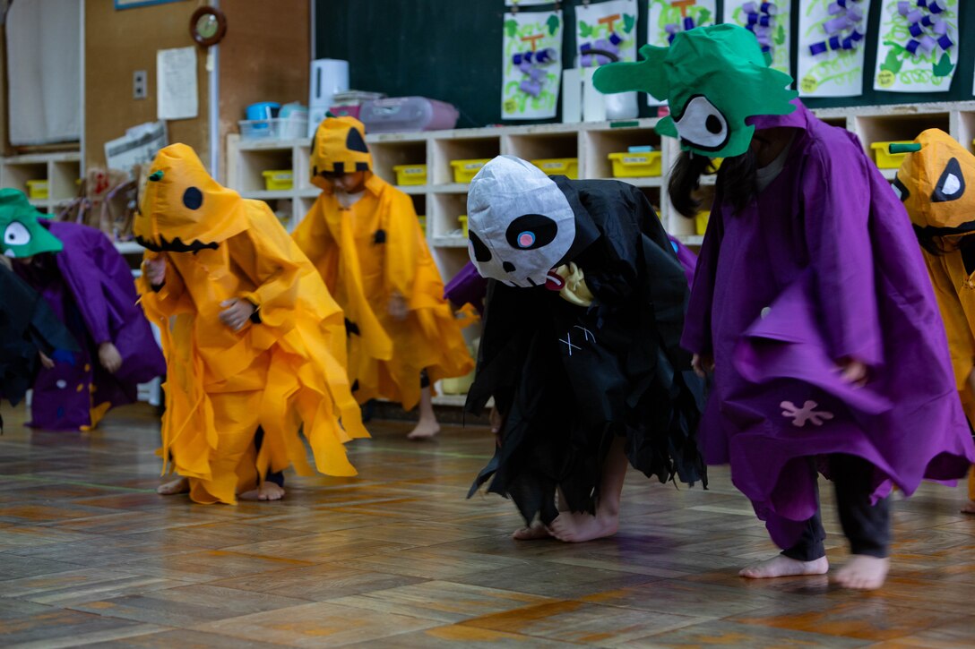 Preschool students perform a dance in celebration of Halloween during a community relations event at Ekimae Hoikuen, Iwakuni, Japan, Oct. 31, 2023. The air station regularly conducts community relations events, such as these, to reinforce the relationship between MCAS Iwakuni members and the local Japanese community. (U.S. Marine Corps photo by Cpl. Peter Rawlins)