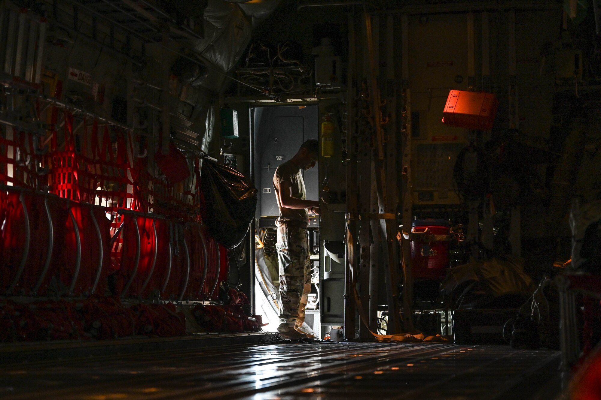 An Airman stands in a doorway.