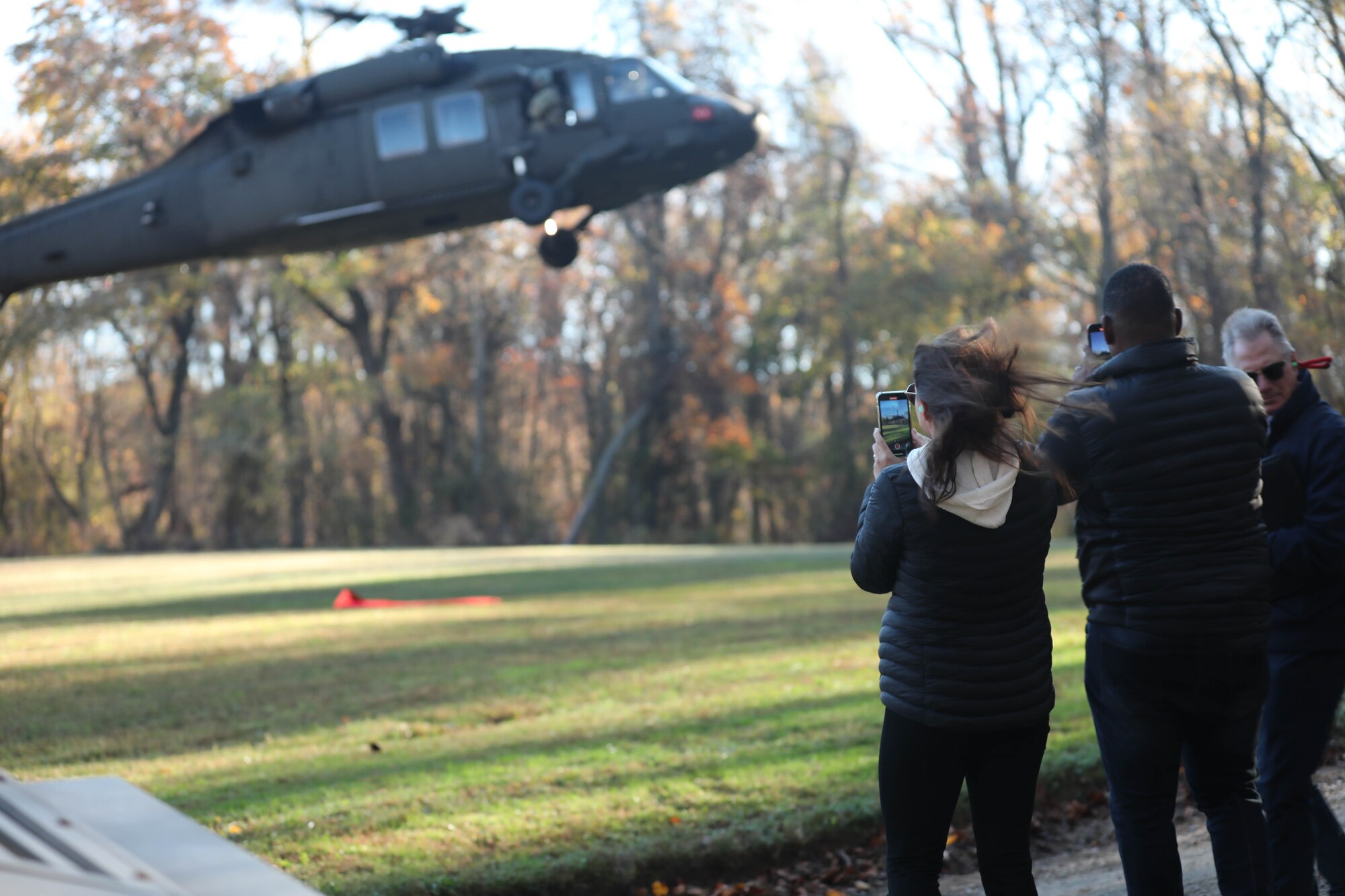 Employers of Maryland National Guard service members observe a UH-60 Blackhawk helicopter lift off during the Maryland National Guard ESGR Bosslift Event on November 3, 2023, at Blum Military Reservation, in Glen Arm, Maryland.