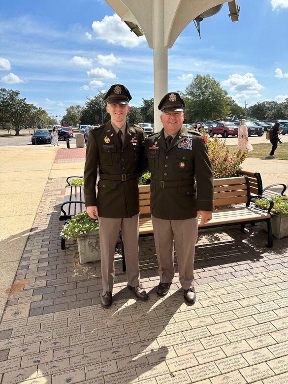 U.S. Army 2nd Lt. Zack Adams, left, poses for a photo with his father, Chief Warrant Officer 5 Rich Adams, after graduating from U.S. Army Initial Entry Rotary Wing school at Fort Novosel, Alabama, Oct. 5, 2023. (Courtesy Photo)