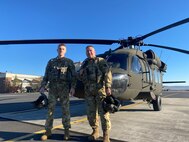 U.S. Army 2nd Lt. Zack Adams, left, and his father Chief Warrant Officer 5 Rich Adams, helicopter pilots with the 28th Expeditionary Combat Aviation Brigade, fly a UH-60 Black Hawk helicopter together for the first time, Nov. 2, 2023. Their flight originated at Muir Army Heliport and took them around the Harrisburg and Fort Indiantown Gap areas. Rich is a 34-year veteran of Army aviation while Zack is a recent graduate of the U.S. Army Initial Entry Rotary Wing school. (U.S. Army National Guard photo by Maj. Travis Mueller)