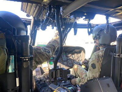 U.S. Army 2nd Lt. Zack Adams, right, and his father Chief Warrant Officer 5 Rich Adams, helicopter pilots with the 28th Expeditionary Combat Aviation Brigade, fly a UH-60 Black Hawk helicopter together for the first time, Nov. 2, 2023. Their flight originated at Muir Army Heliport and took them around the Harrisburg and Fort Indiantown Gap areas. Rich is a 34-year veteran of Army aviation while Zack is a recent graduate of the U.S. Army Initial Entry Rotary Wing school. (U.S. Army National Guard photo by Maj. Travis Mueller)