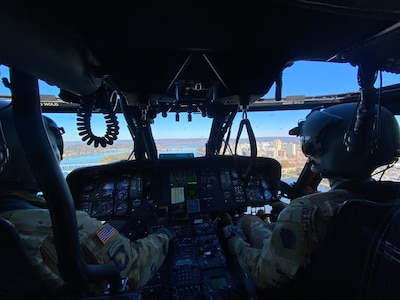 U.S. Army 2nd Lt. Zack Adams, right, and his father Chief Warrant Officer 5 Rich Adams, helicopter pilots with the 28th Expeditionary Combat Aviation Brigade, fly a UH-60 Black Hawk helicopter together for the first time, Nov. 2, 2023. Their flight originated at Muir Army Heliport and took them around the Harrisburg and Fort Indiantown Gap areas. Rich is a 34-year veteran of Army aviation while Zack is a recent graduate of the U.S. Army Initial Entry Rotary Wing school. (U.S. Army National Guard photo by Maj. Travis Mueller)