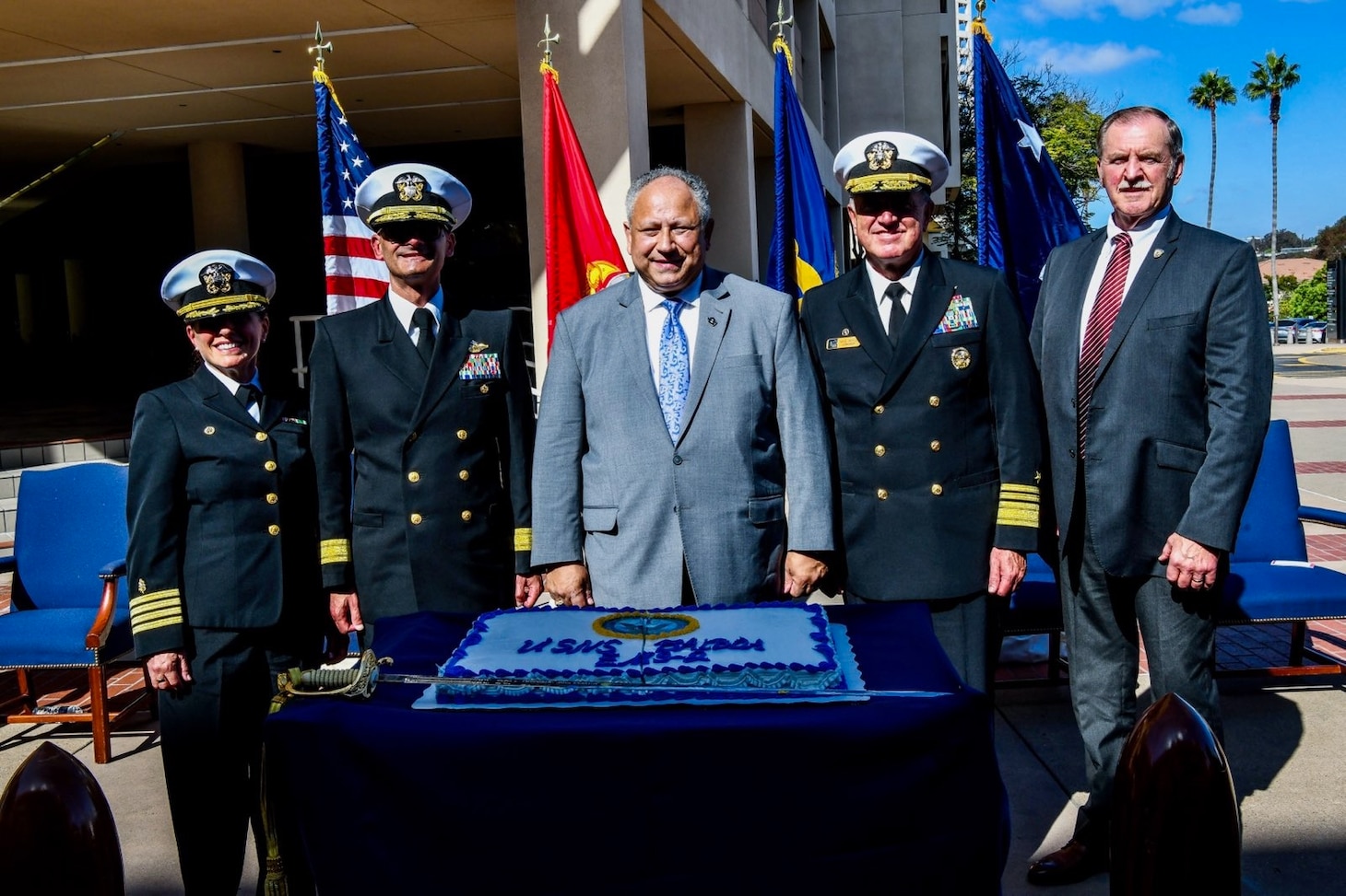 Capt. Elizabeth Adriano, Commanding Officer, Navy Medicine Readiness and Training Command San Diego; Rear Adm. Guido F. Valdes, Commander, Naval Medical Forces Pacific; Secretary of the Navy Carlos Del Toro; Vice Adm. Michael E. Boyle, Commander, U.S. Third Fleet; and Paul Williamson, Wounded Warrior Regiment, pose for a photo during a ceremony at Naval Medical Center San Diego, Oct. 27. At the ceremony, Secretary Del Toro announced that a future Bethesda-class expeditionary medical ship will be named USNS Balboa (EMS 2), The future USNS Balboa honors the legacy and commitment of Navy doctors, nurses, corpsmen, and staff of Balboa Naval Hospital in caring for the needs of U.S. Service Members.