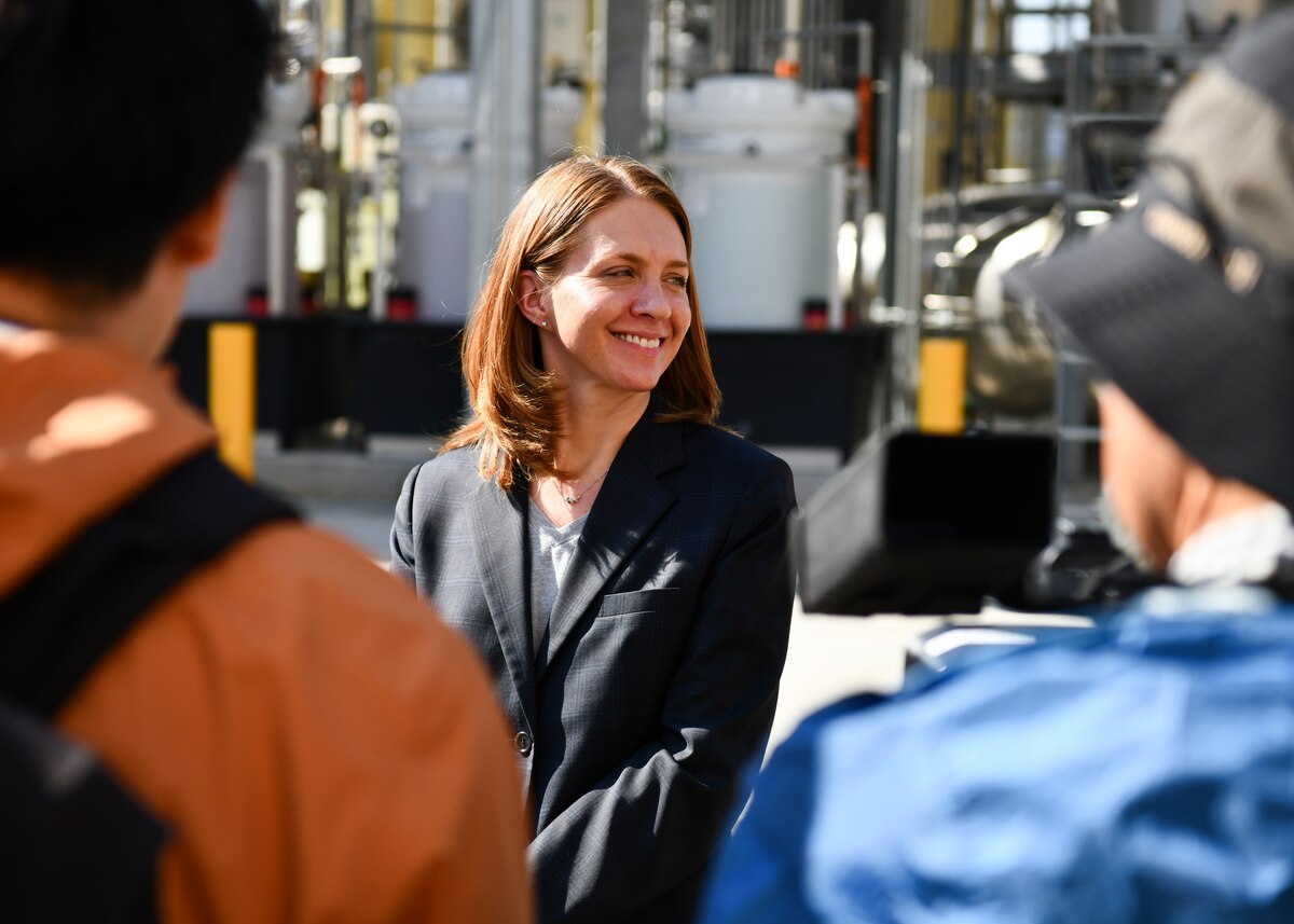 A woman from Yokota talks to the media.