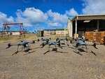 Six production models of the TRV-150C Tactical Resupply Unmanned Aircraft System (TRUAS) arrive at Littoral Logistics Battalion Three (LLB-3), Marine Corps Base Hawaii.