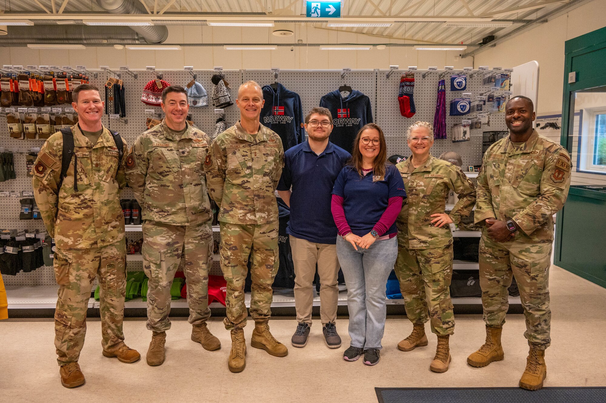 Members of the Third Air Force leadership team pose for a group photo with AAFES team members.