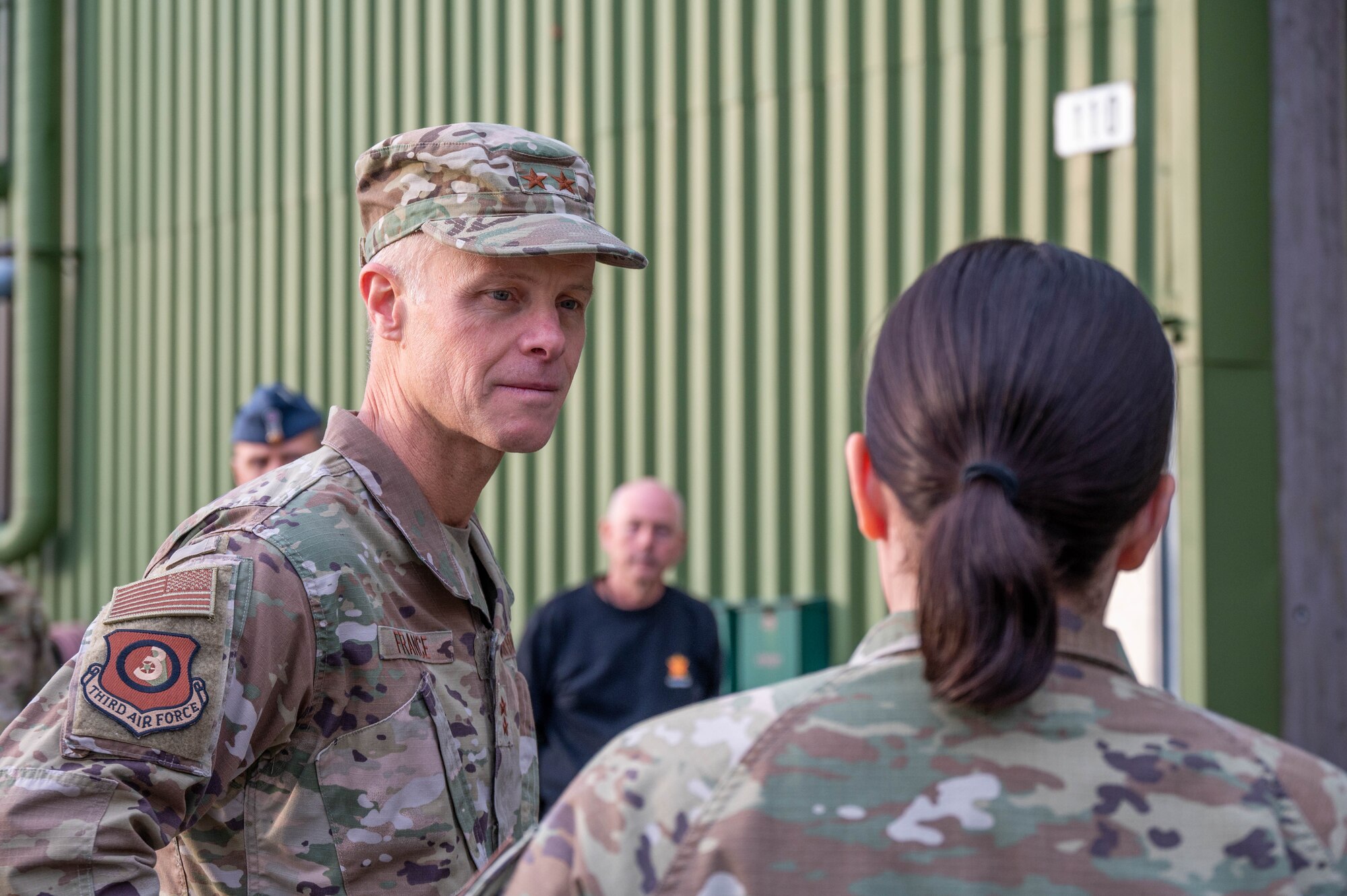 Maj. Gen. France listens to a brief.