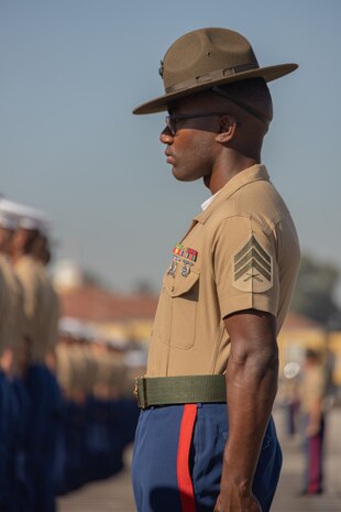 A U.S. Marine Corps drill instructor with Hotel Company, 2nd Recruit Training Battalion, stands in formation during a graduation ceremony at Marine Corps Recruit Depot San Diego, Nov. 3, 2023. Graduation took place at the completion of the 13-week transformation process, which included training for drill, marksmanship, basic combat skills, and Marine Corps customs and traditions. (U.S. Marine Corps photo by Lance Cpl. Janell B. Alvarez)