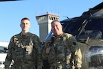 U.S. Army 2nd Lt. Zack Adams, left, and his father, Chief Warrant Officer 5 Rich Adams, helicopter pilots with the 28th Expeditionary Combat Aviation Brigade, flew a UH-60 Black Hawk helicopter together for the first time Nov. 2, 2023, in Pennsylvania. Rich is a 34-year veteran of Army aviation while Zack is a recent graduate of the U.S. Army Initial Entry Rotary Wing school.