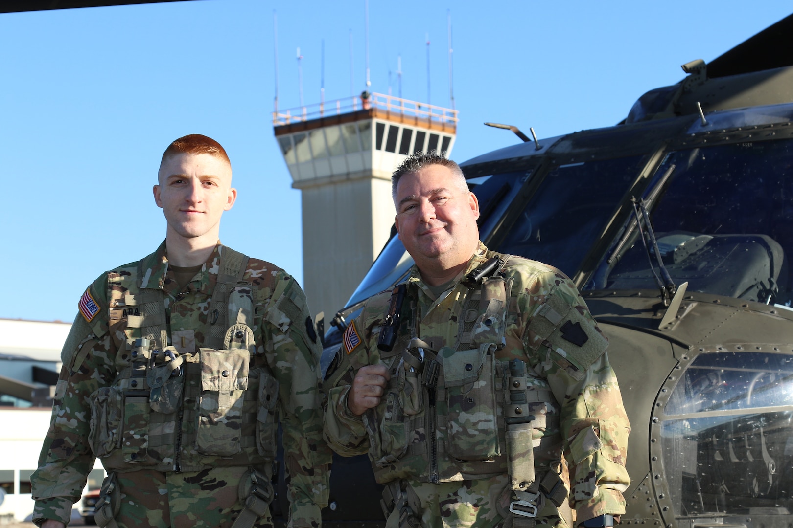 U.S. Army 2nd Lt. Zack Adams, left, and his father, Chief Warrant Officer 5 Rich Adams, helicopter pilots with the 28th Expeditionary Combat Aviation Brigade, flew a UH-60 Black Hawk helicopter together for the first time Nov. 2, 2023, in Pennsylvania. Rich is a 34-year veteran of Army aviation while Zack is a recent graduate of the U.S. Army Initial Entry Rotary Wing school.