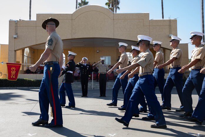 U.S. Marines with Hotel Company, 2nd Recruit Training Battalion, march across the parade deck during their graduation ceremony at Marine Corps Recruit Depot San Diego, Nov. 3, 2023. Graduation took place at the completion of the 13-week transformation, which included training for drill, marksmanship, basic combat skills, and Marine Corps customs and traditions. (U.S. Marine Corps Photo by Lance Cpl. Sarah M. Grawcock)