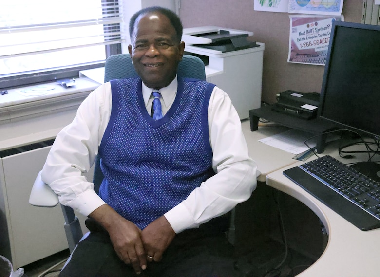 Willard Bush, U.S. Army Corps of Engineers, Mobile District accountant, poses for a photo at his desk, Nov. 1, 2023, at the District headquarters in Mobile, Alabama. Bush, who has been working for the District for 50 years, said that working for the District has been his dream job and a blessing. (U.S. Army photo by Chuck Walker)