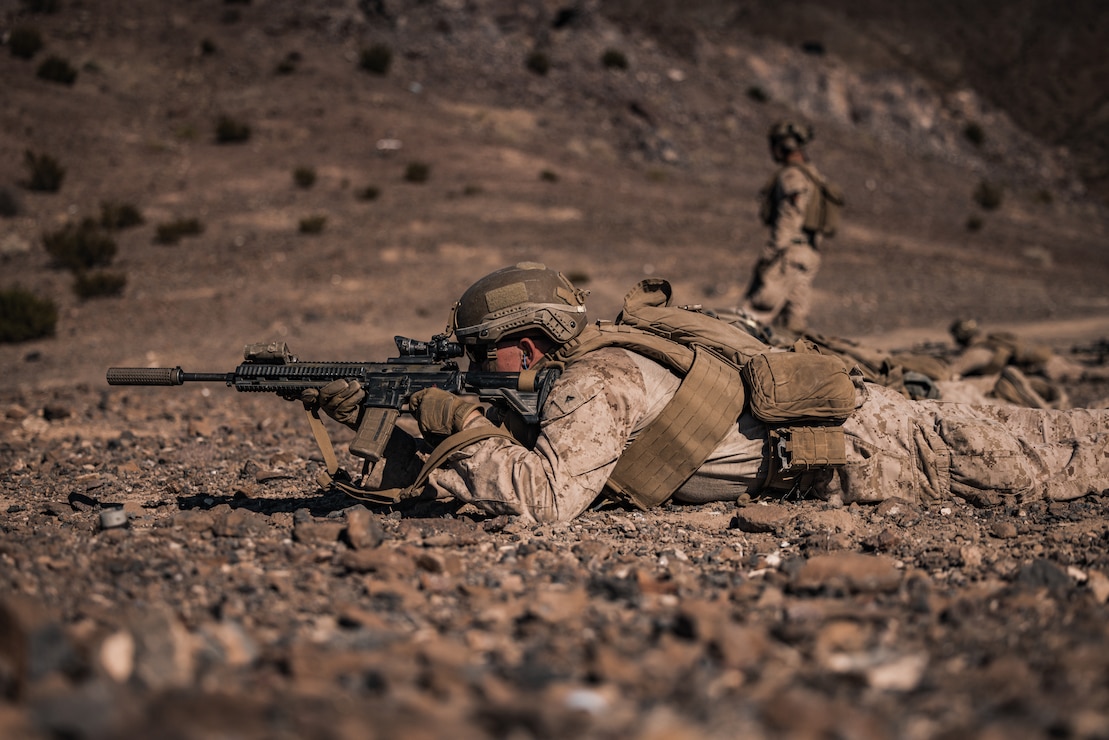 A U.S. Marine Corps infantry Marine with 3rd Battalion, 4th Marine Regiment, 7th Marine Regiment, fires at a simulated target during Exercise Apollo Shield at Marine Corps Air-Ground Combat Center, Twentynine Palms, California, Oct 19. 2023. Exercise Apollo Shield is the culminating event of Marine Corps Warfighting Lab’s 1-year crawl-walk-run bilateral effort to test equipment capabilities and evaluate tactics, techniques, and procedures. The Combat Center provides a training facility capable of truly testing the equipment and it is home to the infantry battalion experiment 2030, the first unit to receive the equipment tested by MCWL.
