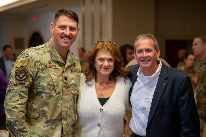 U.S. Air Force Lt. Col. Doug Grabowski, 628th Healthcare Operations Squadron commander, Brenda Gravley, and Joseph Brown, Joint Base Charleston honorary commander, pose for a photo during an honorary commander induction ceremony on JB Charleston, South Carolina, Nov. 2, 2023.