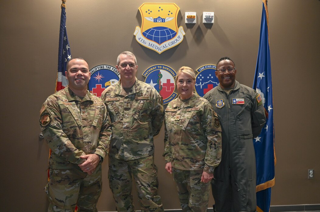 (Left to right) Col. Luis Berrios, 433rd Aerospace Medicine Squadron commander, Maj. Gen. John Bartrum, Mobilization Assistant to the Surgeon General of the Air Force and Space Force, Headquarters U.S. Air Force, Col. Michelle Van Sickle, 433rd Medical Group commander, and Col. Alvin Bradford, 433rd Medical Squadron commander, pose for a photograph at Joint Base San Antonio-Lackland, Texas, Nov. 4, 2023.