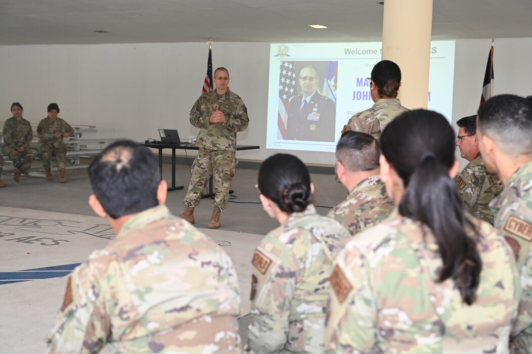 Maj. Gen. John Bartrum, Mobilization Assistant to the Surgeon General of the Air Force and Space Force, Headquarters U.S. Air Force, answers a question from an Airman assigned to the 433rd Aerospace Evacuation Squadron on Joint Base San Antonio-Lackland, Texas, Nov. 4, 2023.
