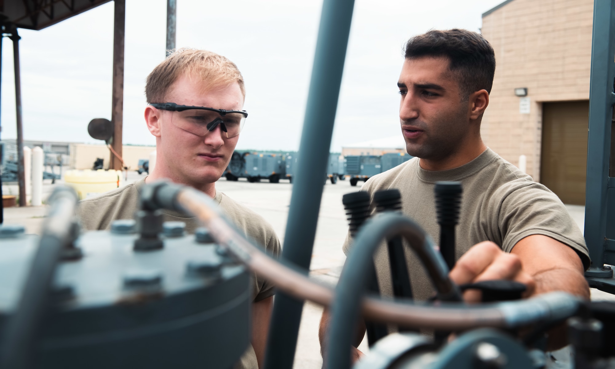 Airmen check equipment.