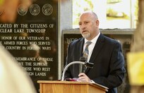 Village of Riverton (Illinois) Mayor Tom Rader speaks during the Clear Lakes Township ceremony.