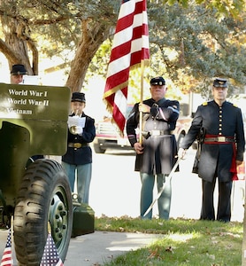 Members of the 114th Regiment, Illinois Volunteer Infantry, Reactivated, during the playing of the National Anthem.