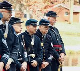 Members of the 114th Regiment, Illinois Volunteer Infantry, Reactivated, listen to one of the ceremony speakers.