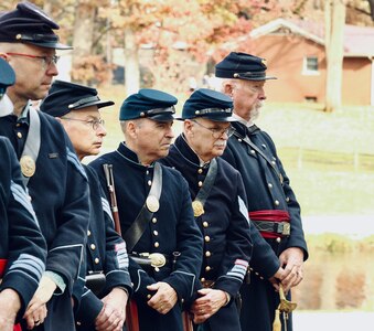 Members of the 114th Regiment, Illinois Volunteer Infantry, Reactivated, listen to one of the ceremony speakers.