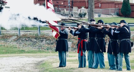 The 114th Regiment, Illinois Volunteer Infantry, Reactivated perform the 21-rifle salute.