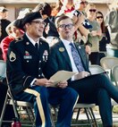 Illinois Army National Guard Staff Sgt. J. Manuel Rojas Garcia and Parker Staab of Staab Funeral Home share a laugh prior to the ceremony.
