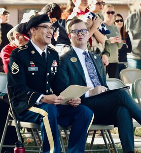 Illinois Army National Guard Staff Sgt. J. Manuel Rojas Garcia and Parker Staab of Staab Funeral Home share a laugh prior to the ceremony.