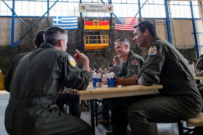 U.S. Airmen assigned to the 124th Fighter Wing, Idaho National Guard attend a briefing at Lechfeld Air Base, Germany with German and Greek counterparts during exercise Air Defender 2023 (AD23), June 13, 2023. Exercise AD23 integrates both U.S. and allied air-power to defend shared values, while leveraging and strengthening vital partnerships to deter aggression around the world. (U.S. Air National Guard photo by Master Sgt. Becky Vanshur)