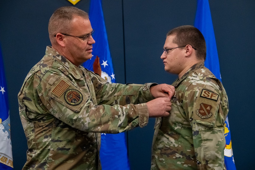 Maj. Gen. Daniel A. DeVoe pins the Airman’s Medal on Senior Airman Matthew B. West.