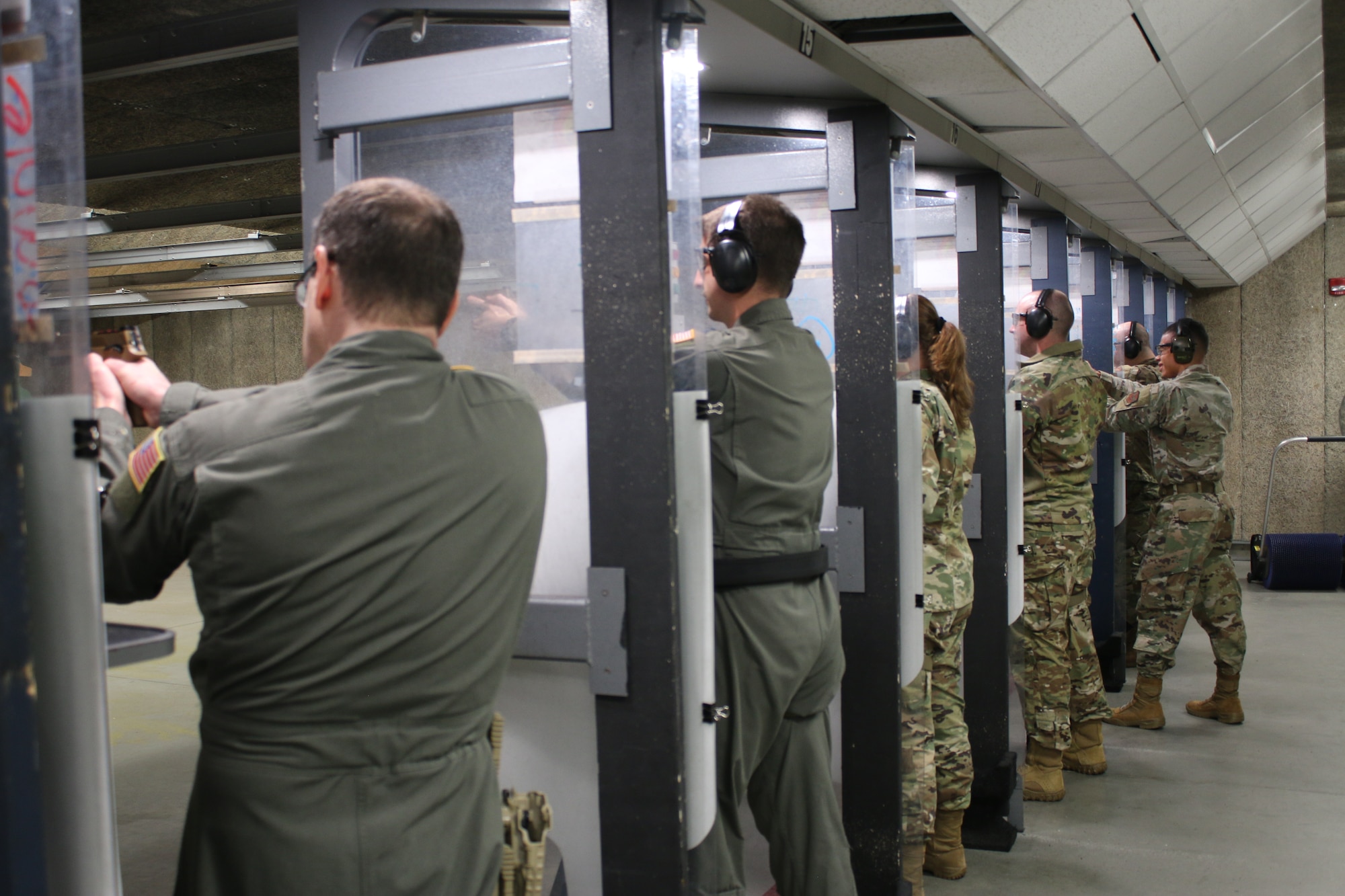 Airmen from the 445th Airlift Wing and 655th Intelligence, Surveillance, and Reconnaissance Wing fire the SIG M18 strike-fire pistol during an Air Force Qualification Course at Wright-Patterson Air Force Base, Ohio, Oct. 15, 2023.