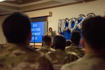 U.S. Air Force Chief Master Sgt. Adrienne Warren, the 99th Air Base Wing command chief, delivers a speech during the noncommissioned officer (NCO) induction ceremony at Nellis Air Force Base, Nevada, Nov. 2, 2023.