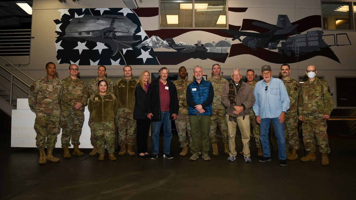 group of people standing in a warehouse