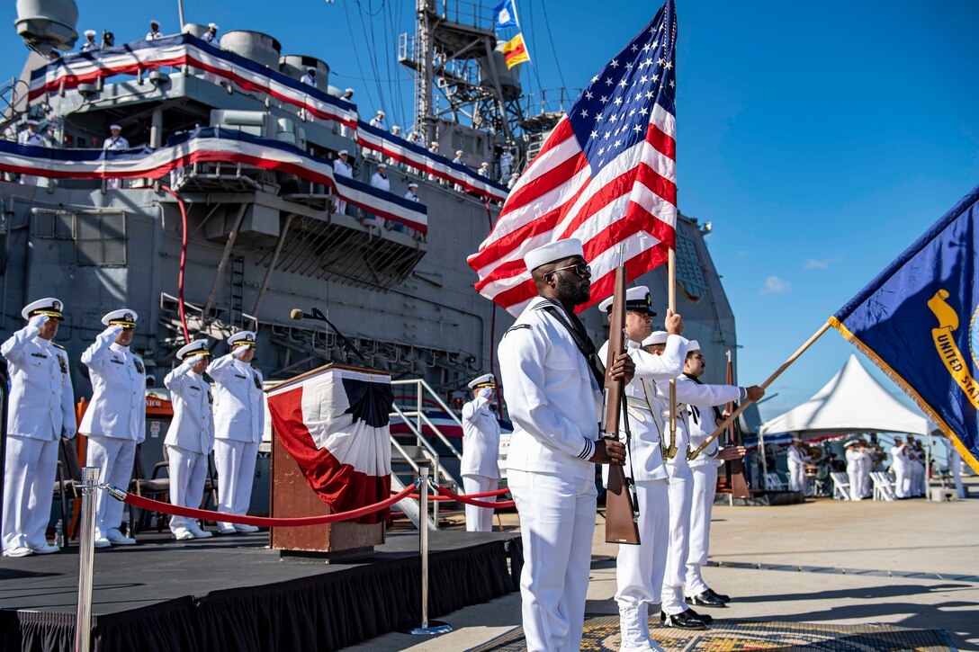 230915-N-TY639-1158 NORFOLK, Virginia (Sept. 15, 2023) - Sailors participate in the national anthem during the decommissioning ceremony of USS San Jacinto (CG 56). San Jacinto was decommissioned after more than 35 years of service. Modern U.S. Navy guided-missile cruisers perform multiple mission including Air Warfare (AW), Undersea Warfare (USW), Naval Surface Fire Support (NSFS) and Surface Warfare (SUW) surface combatants capable of supporting carrier battle groups, amphibious forces or operating independently and as flagships of surface action groups. (U.S. Navy photo by Mass Communication 2nd Class Matthew Nass)