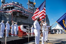 230915-N-TY639-1158 NORFOLK, Virginia (Sept. 15, 2023) - Sailors participate in the national anthem during the decommissioning ceremony of USS San Jacinto (CG 56). San Jacinto was decommissioned after more than 35 years of service. Modern U.S. Navy guided-missile cruisers perform multiple mission including Air Warfare (AW), Undersea Warfare (USW), Naval Surface Fire Support (NSFS) and Surface Warfare (SUW) surface combatants capable of supporting carrier battle groups, amphibious forces or operating independently and as flagships of surface action groups. (U.S. Navy photo by Mass Communication 2nd Class Matthew Nass)